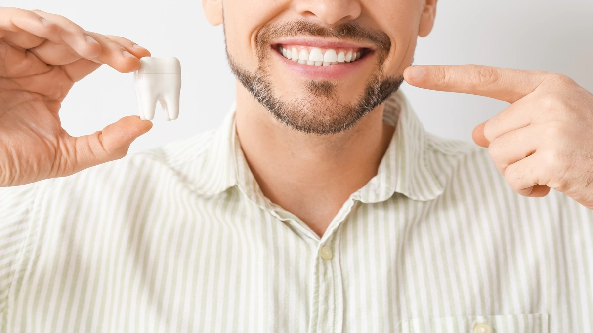 Sonhar com dente caindo sinais, causas e como reagir